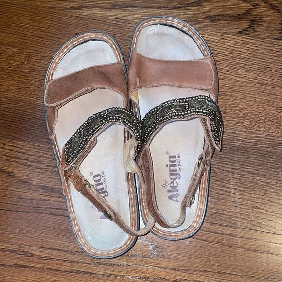 Alegria
by PG Lite brown leather Velcro strap sandals with bronze details on top - Picture 3 of 9